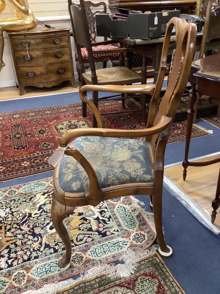 A Queen Anne revival walnut elbow chair